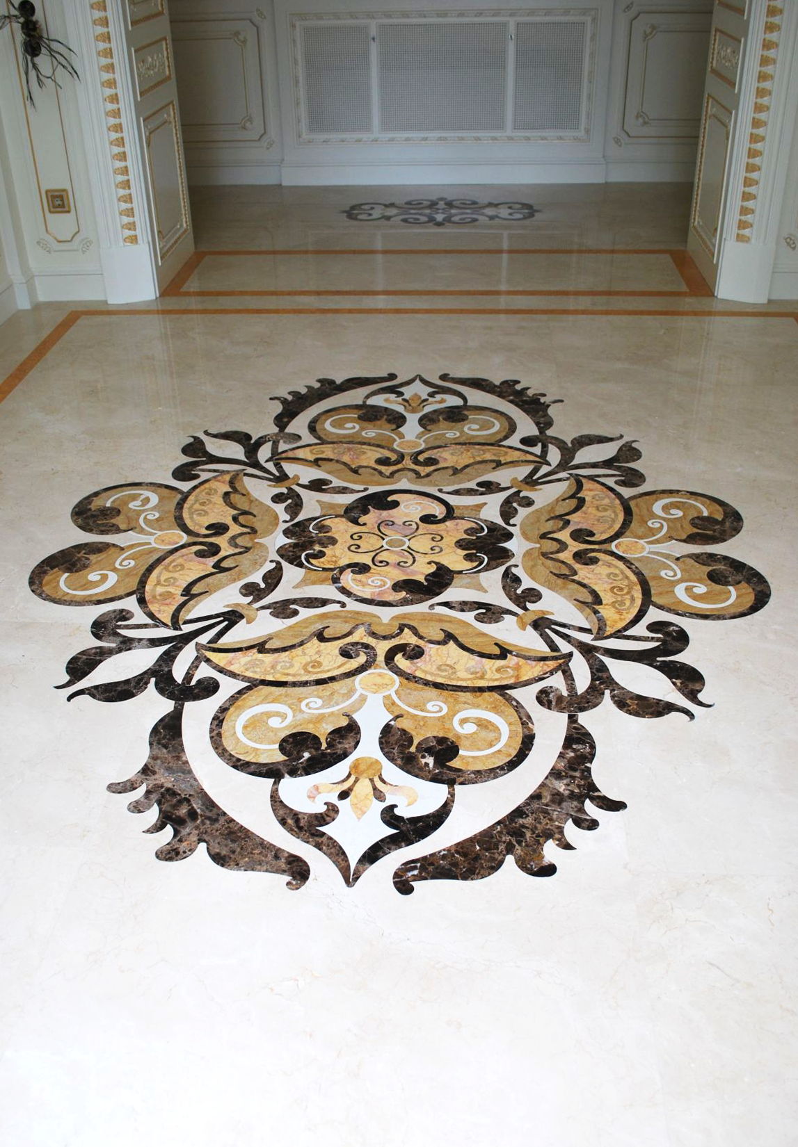 entry with marble inlays flooring