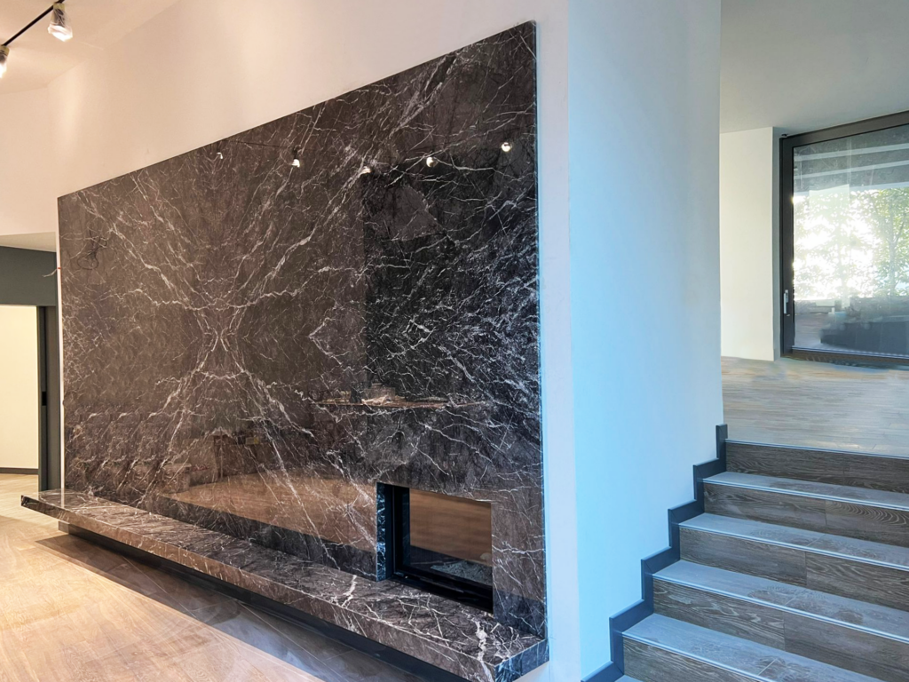 grigio carnico marble tv and fireplace wall