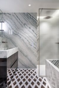 bathroom in cipollino, travertino and emperador dark