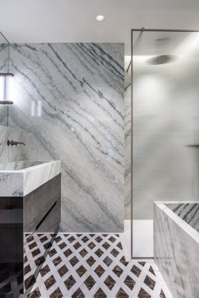 bathroom in cipollino, travertino and emperador dark