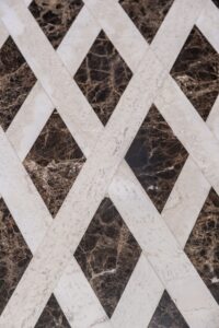 white travertine and emerador dark inlaid flooring