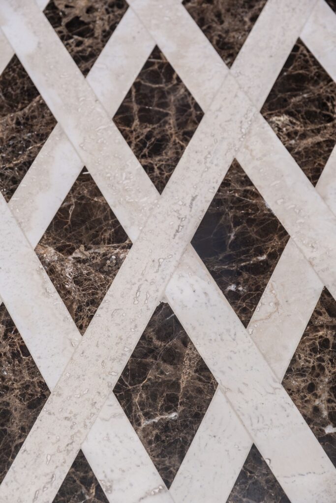 white travertine and emerador dark inlaid flooring